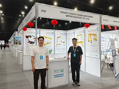 International buyers discussing customized overhead crane solutions with the Yuantai Cranes team at the 2025 Saudi Arabia Industrial Machinery Exhibition.